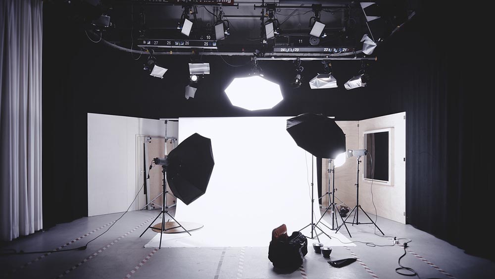 PhotoVibe Studio photography space with professional camera equipment and studio lighting