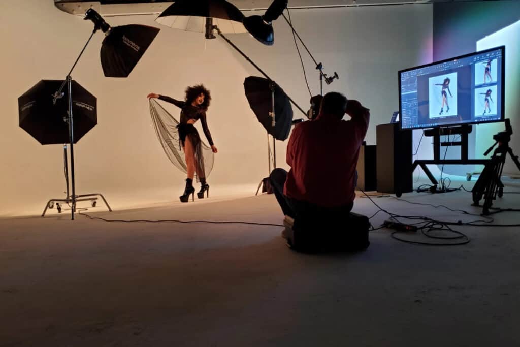 PhotoVibe Studio portrait session with a photographer guiding a client